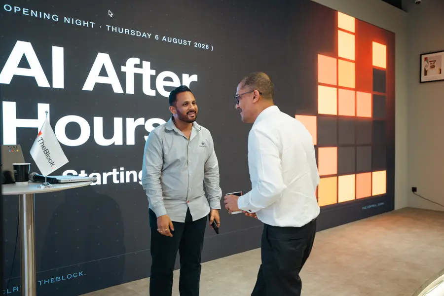 Vishal Sachar and Mahdi Salmanzadeh on stage under the AI After Hours opening-night screen at TheBlock, Dubai.